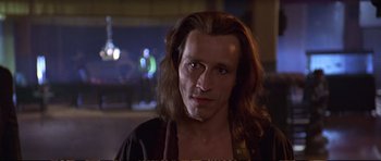 Movie still from “Strange Days” (1995), directed by Kathryn Bigelow – A person with long brown hair; Close Up shot, Low angle