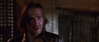 Movie still from “Strange Days” (1995), directed by Kathryn Bigelow – A person wearing a shirt; Close Up shot, Low angle