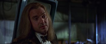 Movie still from “Strange Days” (1995), directed by Kathryn Bigelow – A person with long hair; Close Up shot, Low angle