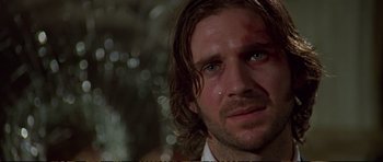 Movie still from “Strange Days” (1995), directed by Kathryn Bigelow – A person with long brown hair; Close Up shot, Low angle