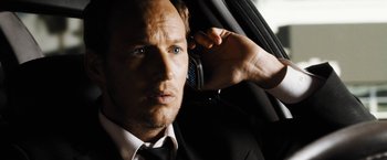 Movie still from “Stretch” (2014), directed by Joe Carnahan – A person talking on a cell phone; Close Up shot, Low angle