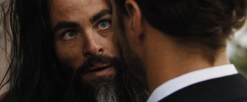 Movie still from “Stretch” (2014), directed by Joe Carnahan – A man with a long beard looking into a mirror; Close Up shot, Over the shoulder angle