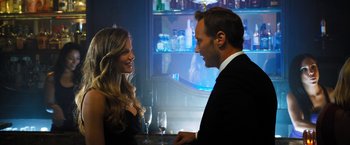 Movie still from “Stretch” (2014), directed by Joe Carnahan – A man and a woman are talking to each other at a bar; Close Up shot, Over the shoulder angle