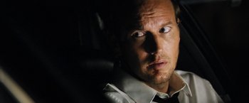Movie still from “Stretch” (2014), directed by Joe Carnahan – A person looking at the camera; Close Up shot, Over the shoulder angle
