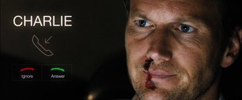 Movie still from “Stretch” (2014), directed by Joe Carnahan – A person with blood on his face; Extreme Close Up shot, Overhead angle