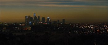 Movie still from “Stretch” (2014), directed by Joe Carnahan – A view of a city at night from a hill; Extreme Wide shot, High angle