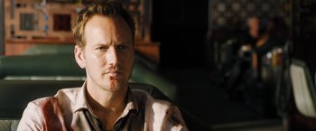 Movie still from “Stretch” (2014), directed by Joe Carnahan – A person with blood on his face; Close Up shot, High angle