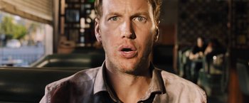 Movie still from “Stretch” (2014), directed by Joe Carnahan – A person with his mouth wide open; Close Up shot, Low angle