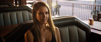 Movie still from “Stretch” (2014), directed by Joe Carnahan – A beautiful young lady sitting in a car; Close Up shot, Over the shoulder angle