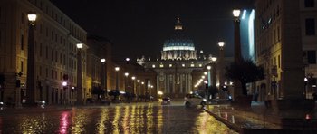 Movie still from “Suburra” (2015), directed by Stefano Sollima – A street view of a church at night with street lights; Extreme Wide shot, Low angle