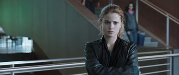 Movie still from “Suburra” (2015), directed by Stefano Sollima – A beautiful young woman with a serious look; Close Up shot, Over the shoulder angle