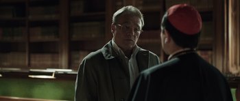 Movie still from “Suburra” (2015), directed by Stefano Sollima – An older man wearing glasses talking to a young woman; Close Up shot, Over the shoulder angle