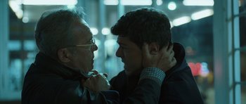 Movie still from “Suburra” (2015), directed by Stefano Sollima – A man and an older man are talking to each other; Close Up shot, Over the shoulder angle