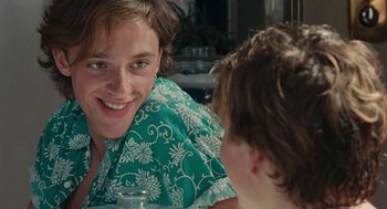 Movie still from “Summer of 85” (2020), directed by François Ozon – A young man sitting next to a young boy in front of a mirror; Close Up shot, Over the shoulder angle