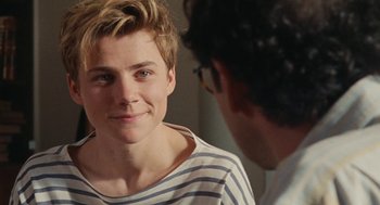 Movie still from “Summer of 85” (2020), directed by François Ozon – A young man is looking at a man in the mirror; Close Up shot, Over the shoulder angle