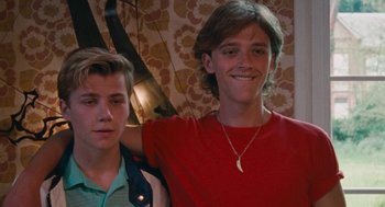 Movie still from “Summer of 85” (2020), directed by François Ozon – Two young men posing for a picture in a room; Close Up shot, Low angle