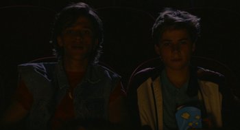 Movie still from “Summer of 85” (2020), directed by François Ozon – Two young men sitting in a car at night; Medium shot, Low angle
