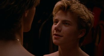 Movie still from “Summer of 85” (2020), directed by François Ozon – A young man is looking into a mirror; Close Up shot, Over the shoulder angle