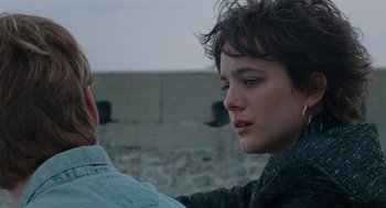 Movie still from “Summer of 85” (2020), directed by François Ozon – A young man and a young woman looking into each other's eyes; Close Up shot, Over the shoulder angle