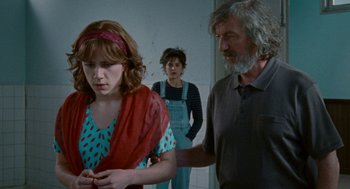 Movie still from “Summer of 85” (2020), directed by François Ozon – A group of people standing in a room together; Medium shot, Over the shoulder angle
