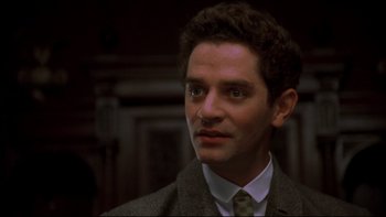 Movie still from “Sunshine” (1999), directed by István Szabó – A person wearing a suit and tie; Close Up shot, Low angle