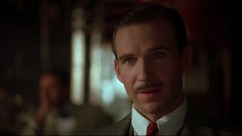 Movie still from “Sunshine” (1999), directed by István Szabó – A person wearing a suit and a tie; Close Up shot, Low angle