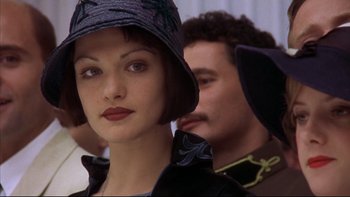 Movie still from “Sunshine” (1999), directed by István Szabó – A woman in a hat and a man in a suit; Close Up shot, Over the shoulder angle