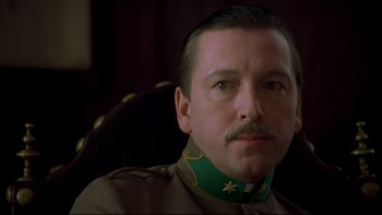 Movie still from “Sunshine” (1999), directed by István Szabó – A person wearing a military uniform; Close Up shot, Low angle