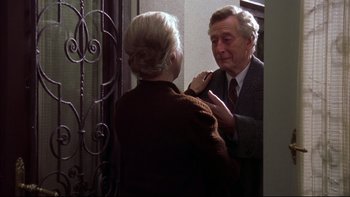 Movie still from “Sunshine” (1999), directed by István Szabó – An older man and a younger woman looking at each other in a mirror; Medium shot, Over the shoulder angle