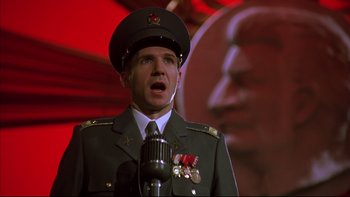 Movie still from “Sunshine” (1999), directed by István Szabó – A man in a military uniform talking into a microphone; Close Up shot, Low angle