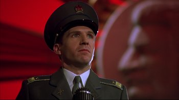 Movie still from “Sunshine” (1999), directed by István Szabó – A man in a military uniform is holding a microphone; Close Up shot, Low angle