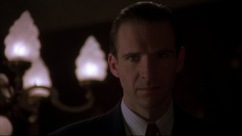 Movie still from “Sunshine” (1999), directed by István Szabó – A person wearing a suit and tie; Close Up shot, Low angle