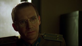 Movie still from “Sunshine” (1999), directed by István Szabó – A man wearing glasses and a military uniform; Close Up shot, Low angle