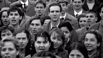 Movie still from “Sunshine” (1999), directed by István Szabó – A black and white photo of a group of people; Close Up shot, High angle