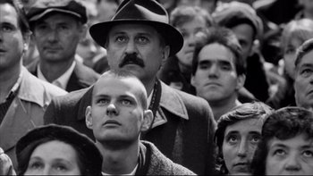Movie still from “Sunshine” (1999), directed by István Szabó – Black and white photograph of a crowd of people; Close Up shot, Low angle