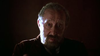 Movie still from “Sunshine” (1999), directed by István Szabó – An old man with a beard is looking at the camera; Close Up shot, Low angle