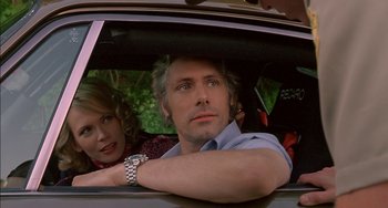 Movie still from “Super Troopers” (2001), directed by Jay Chandrasekhar – A man and a woman sitting in the back of a car; Close Up shot, Low angle