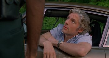 Movie still from “Super Troopers” (2001), directed by Jay Chandrasekhar – A person in a car; Close Up shot, Over the shoulder angle