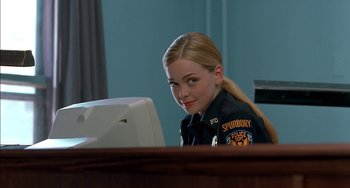 Movie still from “Super Troopers” (2001), directed by Jay Chandrasekhar – A police officer sitting in front of a computer monitor; Close Up shot, Over the shoulder angle