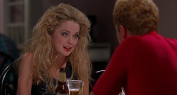 Movie still from “Super Troopers” (2001), directed by Jay Chandrasekhar – A woman sitting at a table talking to a man; Close Up shot, Over the shoulder angle