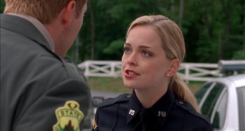 Movie still from “Super Troopers” (2001), directed by Jay Chandrasekhar – A police officer talking to a man in uniform; Close Up shot, Over the shoulder angle