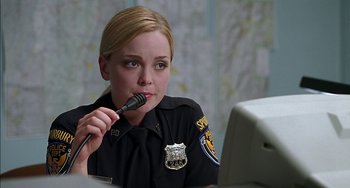 Movie still from “Super Troopers” (2001), directed by Jay Chandrasekhar – A police officer sitting in front of a computer; Close Up shot, Over the shoulder angle