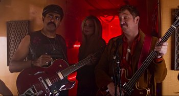 Movie still from “Super Troopers 2” (2018), directed by Jay Chandrasekhar – A group of people that are playing some instruments; Medium shot, Low angle
