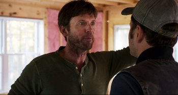 Movie still from “Super Troopers 2” (2018), directed by Jay Chandrasekhar – A man in a green shirt talking to another man in a hat; Close Up shot, Over the shoulder angle