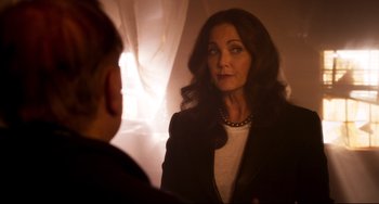 Movie still from “Super Troopers 2” (2018), directed by Jay Chandrasekhar – A woman is looking at herself in the mirror; Close Up shot, Over the shoulder angle