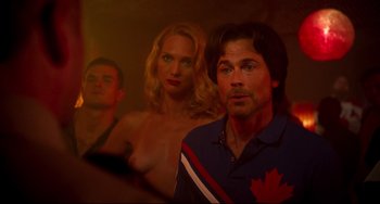 Movie still from “Super Troopers 2” (2018), directed by Jay Chandrasekhar – A man and two women standing next to each other; Medium shot, Over the shoulder angle