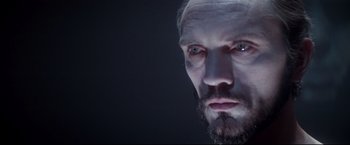 Movie still from “Superman II” (1980), directed by Richard Lester – A man's face in a dark room; Close Up shot, Low angle