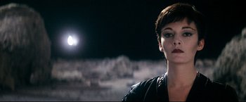 Movie still from “Superman II” (1980), directed by Richard Lester – A person wearing a black jacket; Close Up shot, Over the shoulder angle