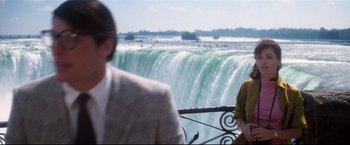 Movie still from “Superman II” (1980), directed by Richard Lester – A man and a woman standing in front of a body of water; Medium shot, Over the shoulder angle