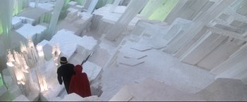 Movie still from “Superman II” (1980), directed by Richard Lester – A person standing in front of a wall made out of blocks; Extreme Wide shot, High angle